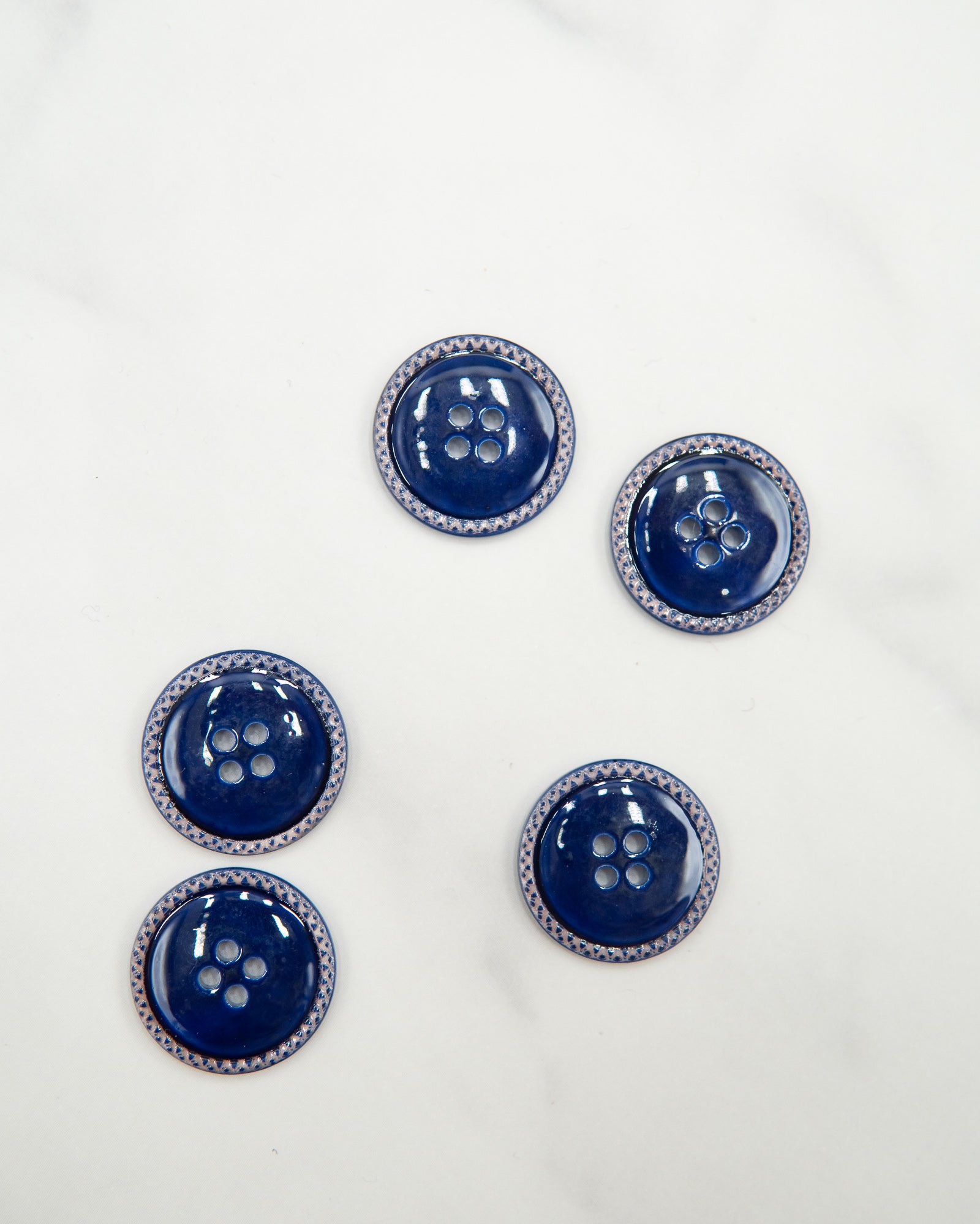 Glossy pale river shell buttons with textured edge