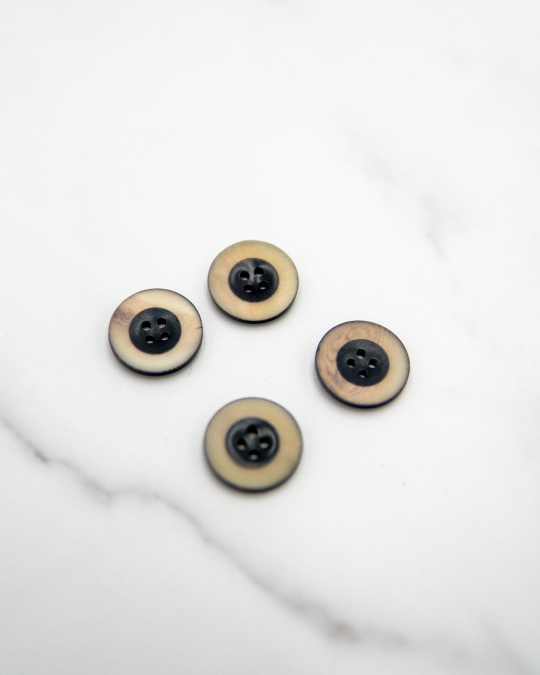 Dark navy corozo buttons with grainy matte cream rim - 20 mm or 3/4"