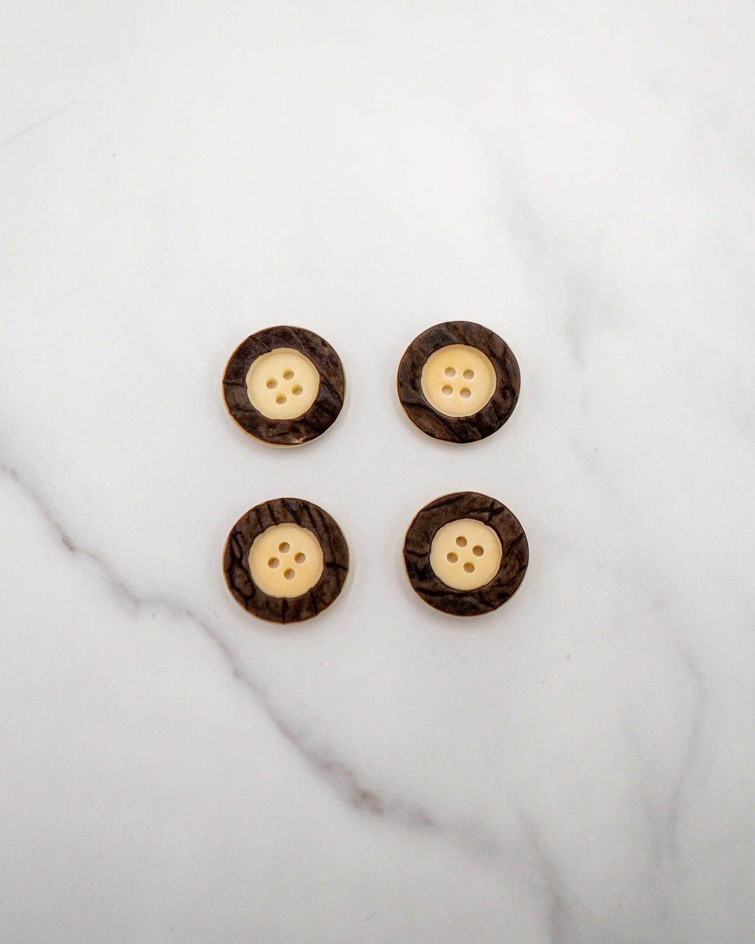 Natural corozo buttons with raised nut skin rim - 22 mm or 7/8