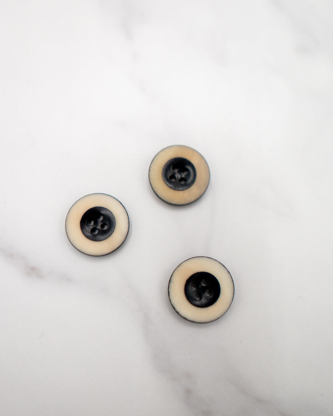 Dark navy corozo buttons with grainy matte cream rim - 20 mm or 3/4"