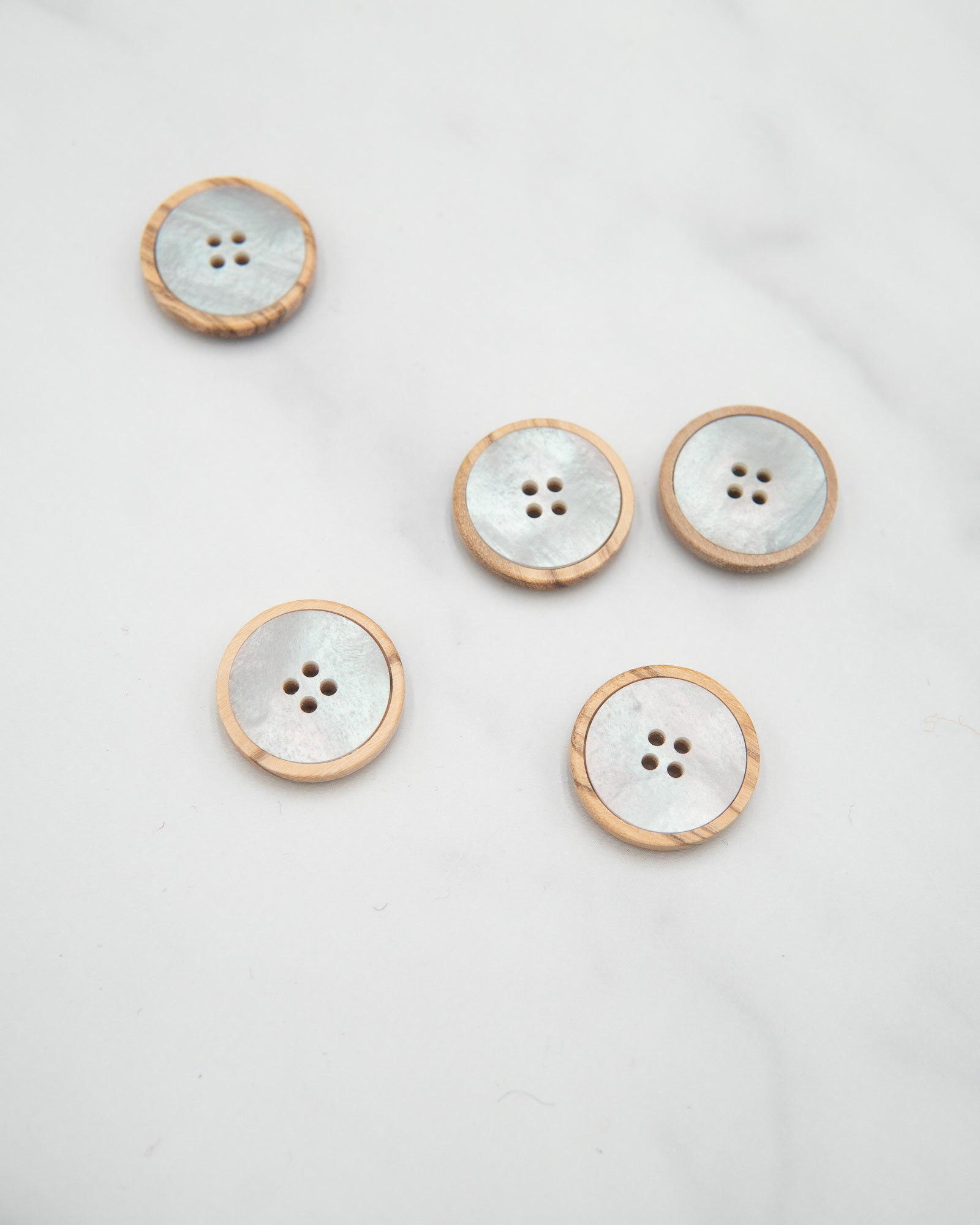 Pale wooden buttons with pearly insert - 20mm / 3/4”
