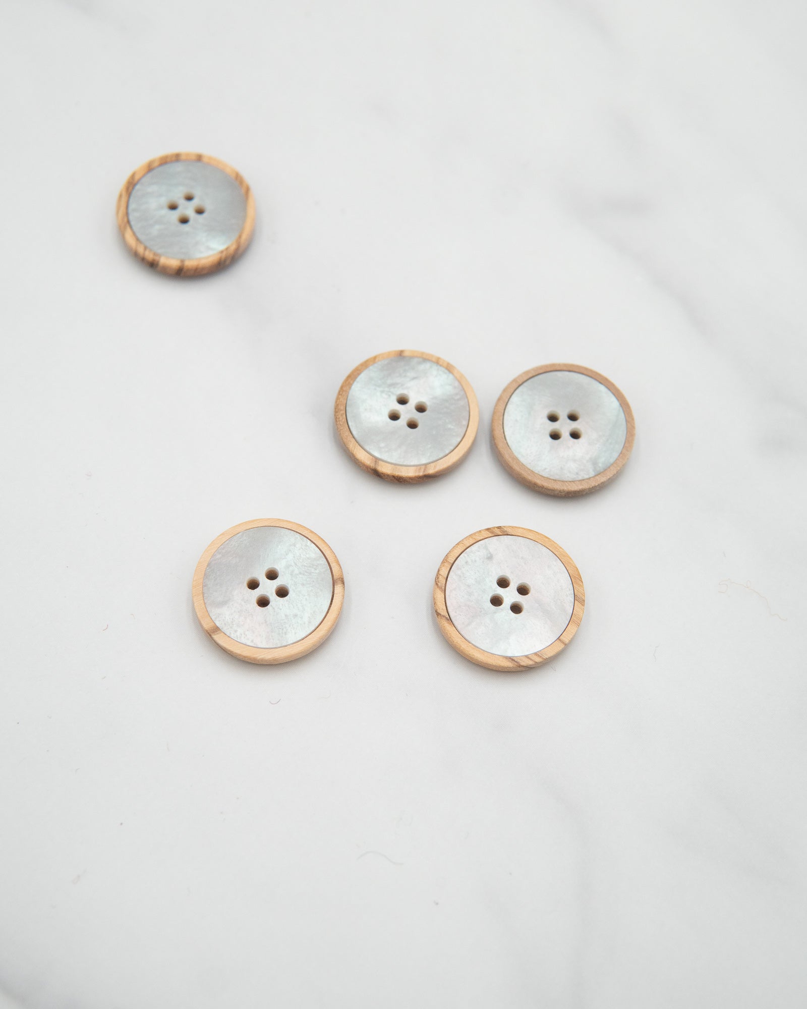 Pale wooden buttons with pearly insert - 20mm / 3/4”